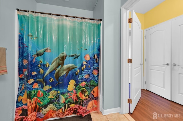 2022 Edward Stec Blvd, Edison, NJ 08837 - full bath featuring a shower with shower curtain, baseboards, and tile patterned flooring