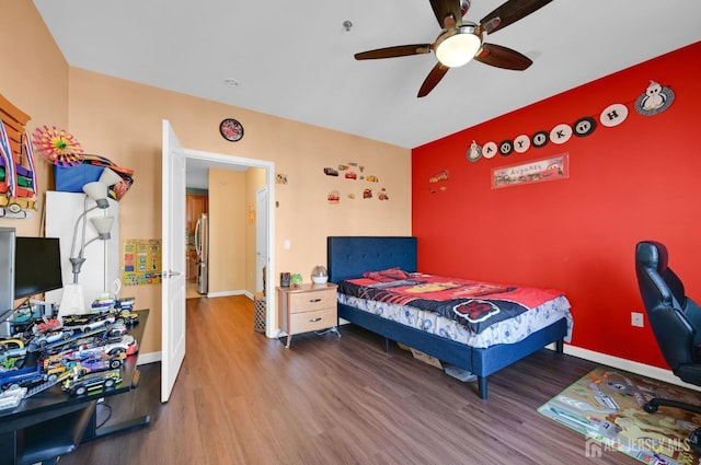 2022 Edward Stec Blvd, Edison, NJ 08837 - bedroom with wood finished floors, baseboards, and freestanding refrigerator