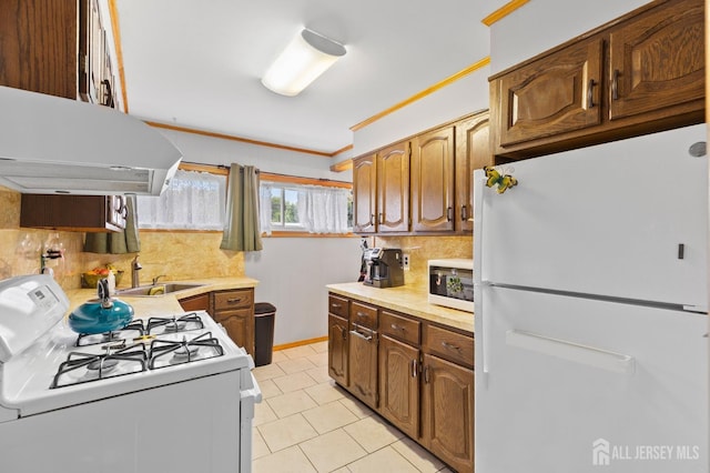 75 Princeton Rd, Old Bridge, NJ 08859 - kitchen featuring white appliances, ventilation hood, a sink, ornamental molding, and light countertops