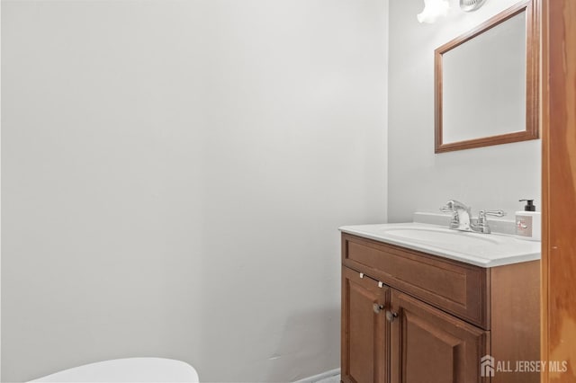 75 Princeton Rd, Old Bridge, NJ 08859 - half bath featuring vanity, toilet, and baseboards