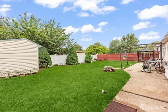 75 Princeton Rd, Old Bridge, NJ 08859 - view of yard featuring a patio area and an outbuilding