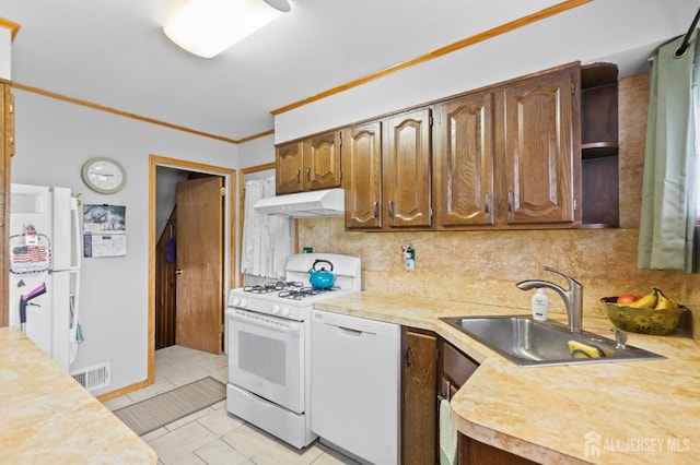 75 Princeton Rd, Old Bridge, NJ 08859 - kitchen with under cabinet range hood, white appliances, light countertops, decorative backsplash, and ornamental molding