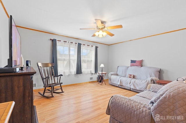 75 Princeton Rd, Old Bridge, NJ 08859 - living room featuring wood finished floors, ceiling fan, crown molding, and baseboards