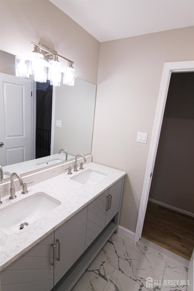 6 Joan St, South Brunswick, NJ 08824 - full bath with double vanity, a sink, and marble finish floor