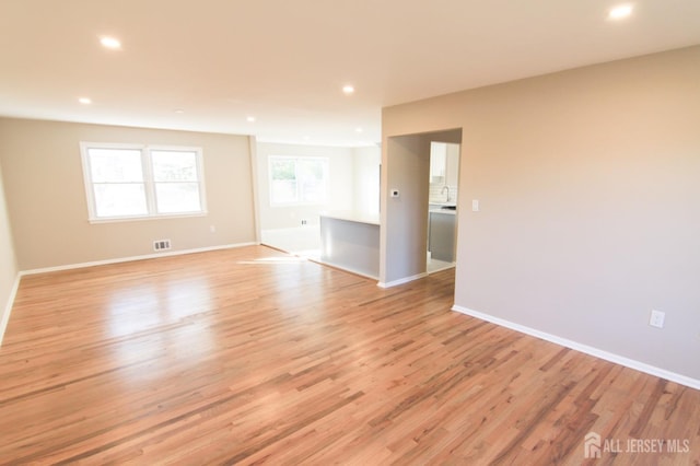 6 Joan St, South Brunswick, NJ 08824 - unfurnished room with recessed lighting, visible vents, baseboards, and light wood-type flooring