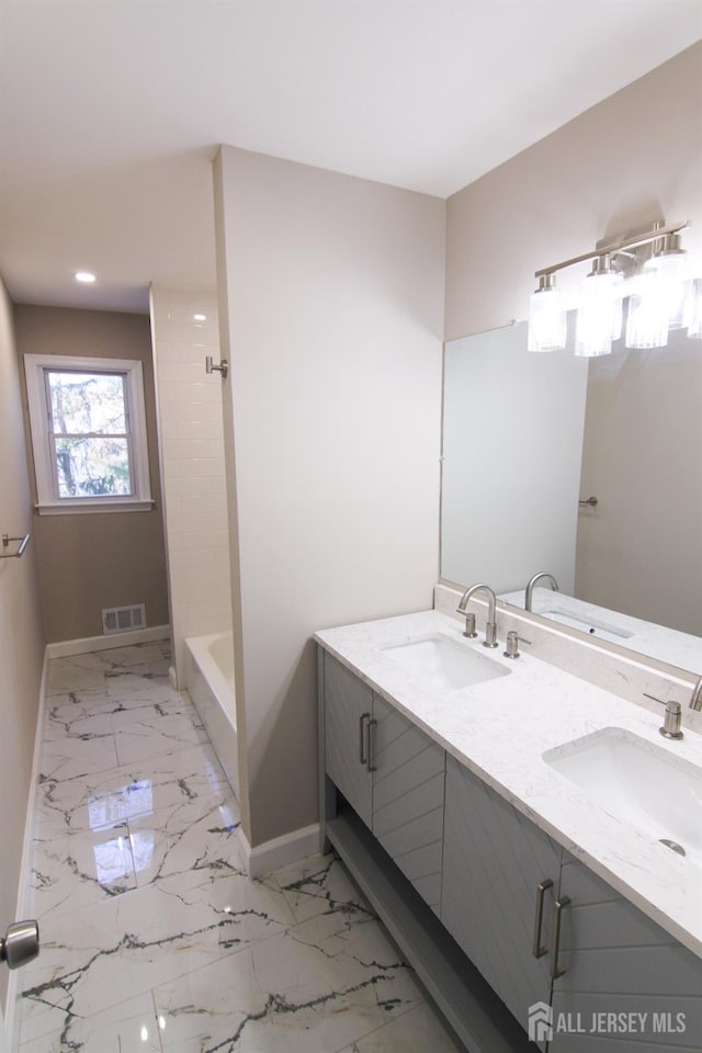 6 Joan St, South Brunswick, NJ 08824 - full bath with marble finish floor, a sink, baseboards, and visible vents