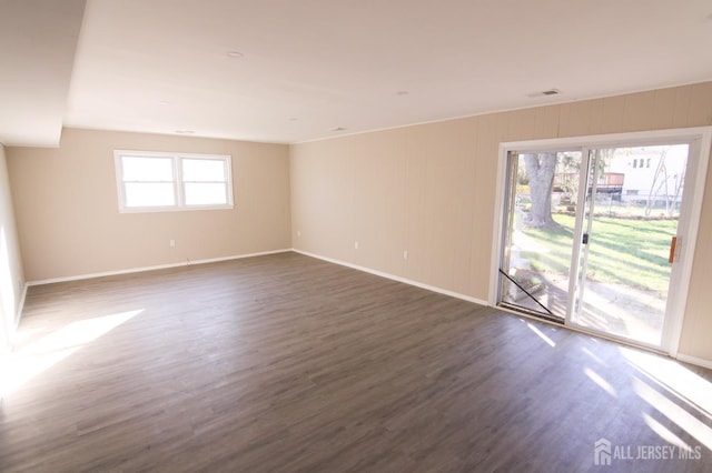 6 Joan St, South Brunswick, NJ 08824 - spare room with baseboards and dark wood-type flooring