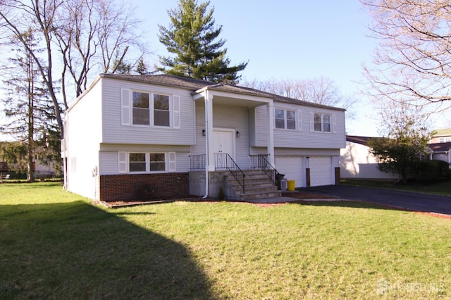 6 Joan St, South Brunswick, NJ 08824 - bi-level home featuring driveway, a front lawn, brick siding, and a garage