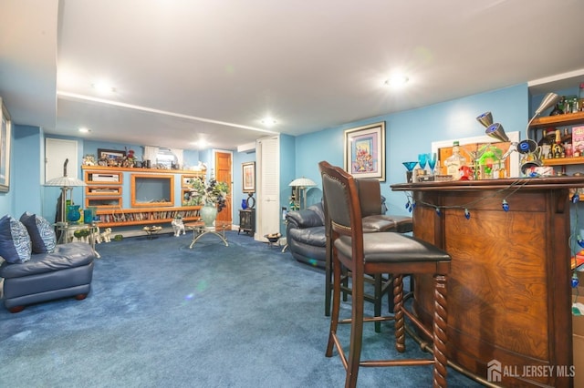 interior space featuring a bar, carpet floors, and recessed lighting