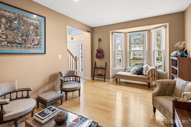sitting room with recessed lighting, wood finished floors, and baseboards