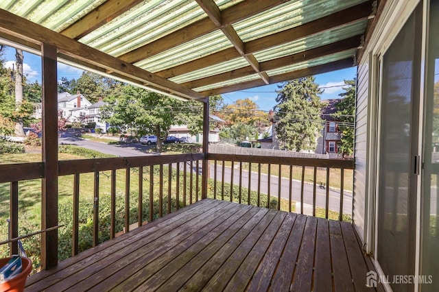 deck with a lawn and a residential view