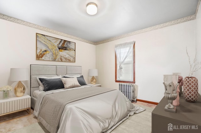 bedroom featuring radiator heating unit, light carpet, and baseboards