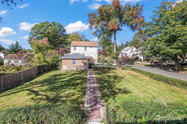 view of yard featuring a residential view and fence