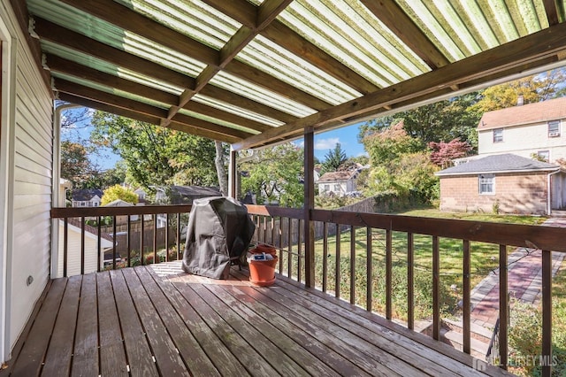wooden terrace with an outbuilding