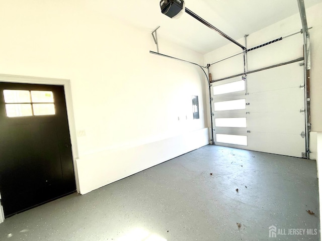 garage featuring a garage door opener