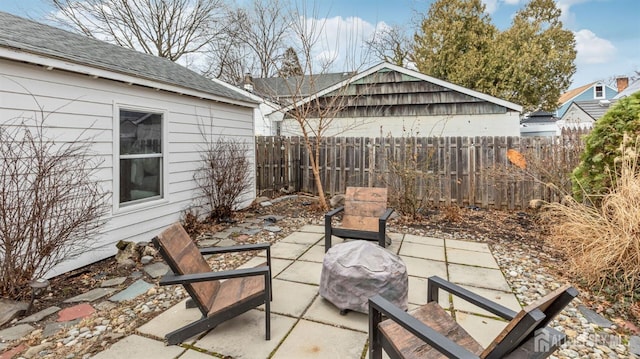 view of patio featuring fence