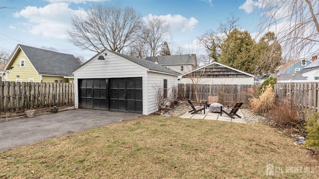 detached garage featuring fence