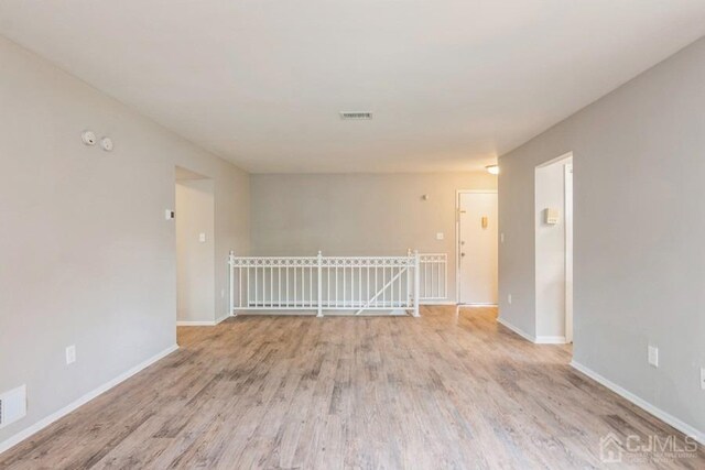 spare room featuring light hardwood / wood-style floors