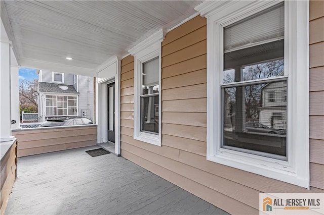 view of property exterior with covered porch