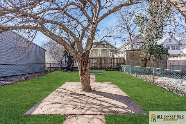view of yard with a fenced backyard and a patio