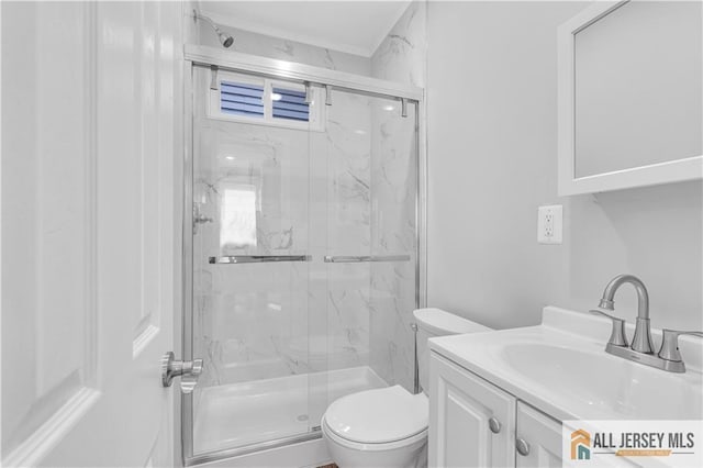 full bathroom featuring vanity, a marble finish shower, and toilet