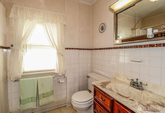 1107 River Rd, Piscataway, NJ 08854 - full bathroom featuring ornamental molding, toilet, vanity, tile patterned flooring, and tile walls