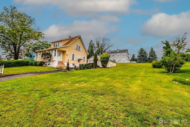 1107 River Rd, Piscataway, NJ 08854 - view of side of home with a yard and a chimney