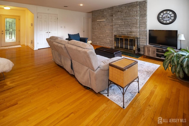 294 Fresh Pond Rd, South Brunswick, NJ 08902 - living room featuring wood finished floors, a fireplace, and arched walkways