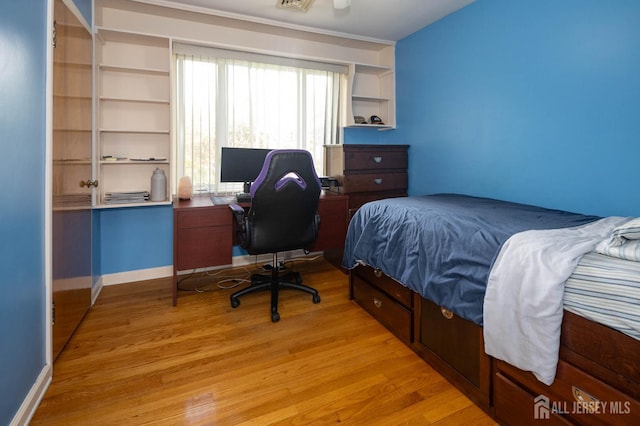 294 Fresh Pond Rd, South Brunswick, NJ 08902 - bedroom with light wood-style floors and a desk