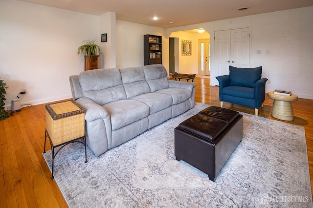 294 Fresh Pond Rd, South Brunswick, NJ 08902 - living area featuring arched walkways, wood finished floors, and recessed lighting