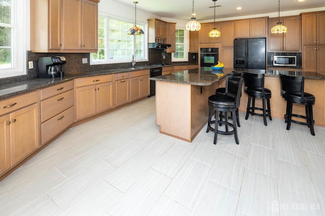 294 Fresh Pond Rd, South Brunswick, NJ 08902 - kitchen featuring black appliances, backsplash, a center island, pendant lighting, and a breakfast bar