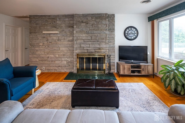 294 Fresh Pond Rd, South Brunswick, NJ 08902 - living area featuring wood finished floors and a stone fireplace
