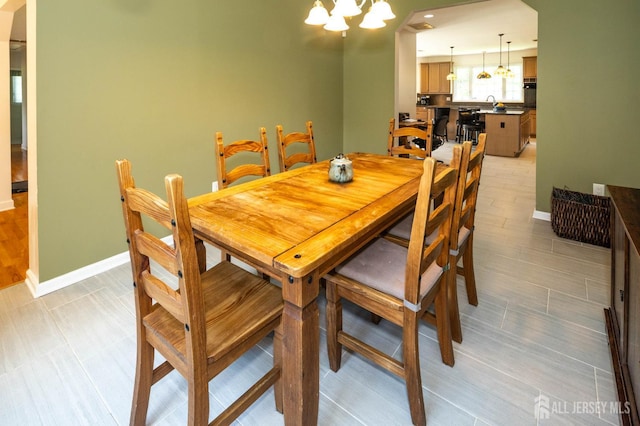 294 Fresh Pond Rd, South Brunswick, NJ 08902 - dining room with a chandelier and baseboards