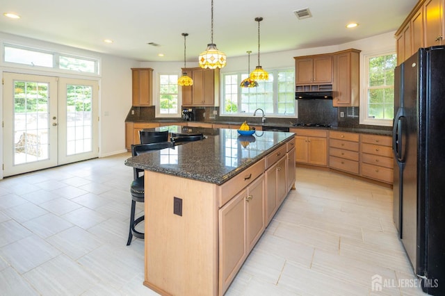 294 Fresh Pond Rd, South Brunswick, NJ 08902 - kitchen with freestanding refrigerator, tasteful backsplash, a center island, a kitchen breakfast bar, and recessed lighting