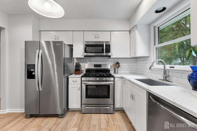 45 Kenmore Rd, Edison, NJ 08817 - kitchen featuring stainless steel appliances, white cabinetry, and tasteful backsplash