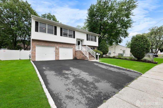 45 Kenmore Rd, Edison, NJ 08817 - split foyer home with brick siding, asphalt driveway, and an attached garage