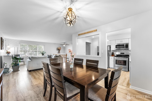 45 Kenmore Rd, Edison, NJ 08817 - dining area featuring light wood finished floors, a ceiling fan, and a chandelier