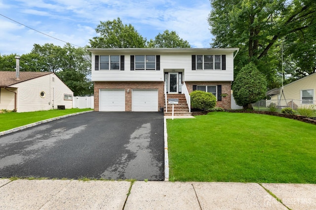 45 Kenmore Rd, Edison, NJ 08817 - raised ranch featuring brick siding, driveway, and an attached garage
