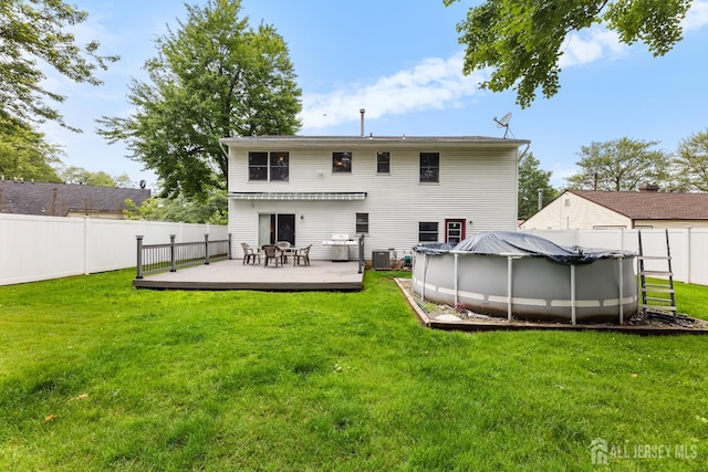 45 Kenmore Rd, Edison, NJ 08817 - back of house with a wooden deck and a fenced backyard