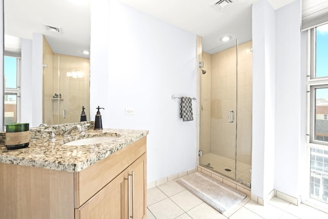 20 Livingston Ave Unit 601, New Brunswick, NJ 08901 - full bathroom with a stall shower, tile patterned flooring, vanity, healthy amount of natural light, and recessed lighting