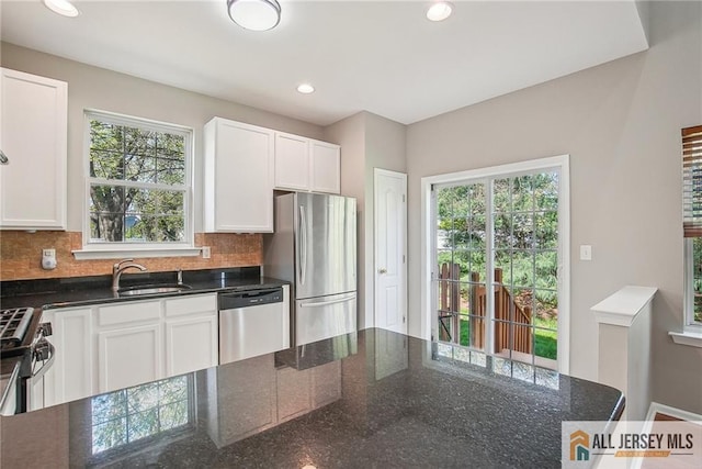 1115 Joseph Ct, South Plainfield, NJ 07080 - kitchen with appliances with stainless steel finishes, decorative backsplash, white cabinetry, recessed lighting, and a sink