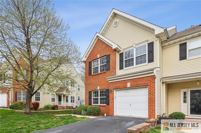 1115 Joseph Ct, South Plainfield, NJ 07080 - traditional-style house with brick siding, a garage, asphalt driveway, and a front lawn