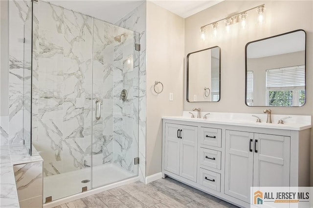 1115 Joseph Ct, South Plainfield, NJ 07080 - full bathroom with a marble finish shower, double vanity, and baseboards