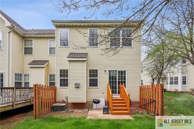 1115 Joseph Ct, South Plainfield, NJ 07080 - rear view of property featuring cooling unit, a wooden deck, and fence