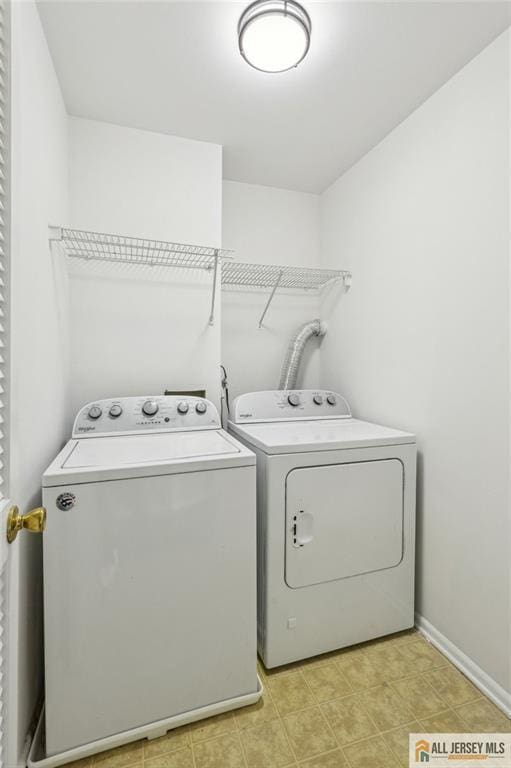 1115 Joseph Ct, South Plainfield, NJ 07080 - clothes washing area with washing machine and clothes dryer