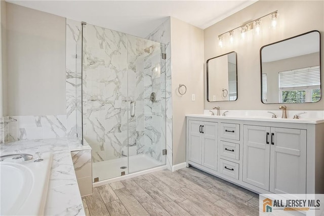 1115 Joseph Ct, South Plainfield, NJ 07080 - bathroom with a marble finish shower, a bath, double vanity, and baseboards