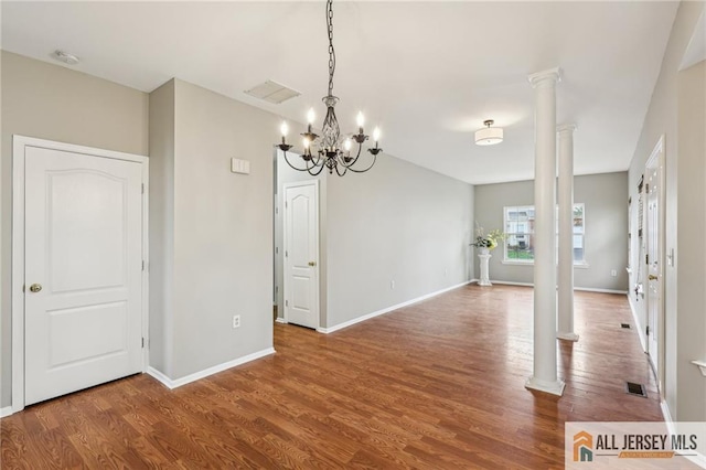 1115 Joseph Ct, South Plainfield, NJ 07080 - unfurnished room featuring decorative columns, wood finished floors, a chandelier, and a smoke detector