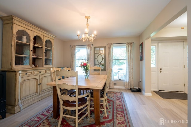 10 Chelsea Ct, South Brunswick, NJ 08810 - dining area with a chandelier and light wood-type flooring
