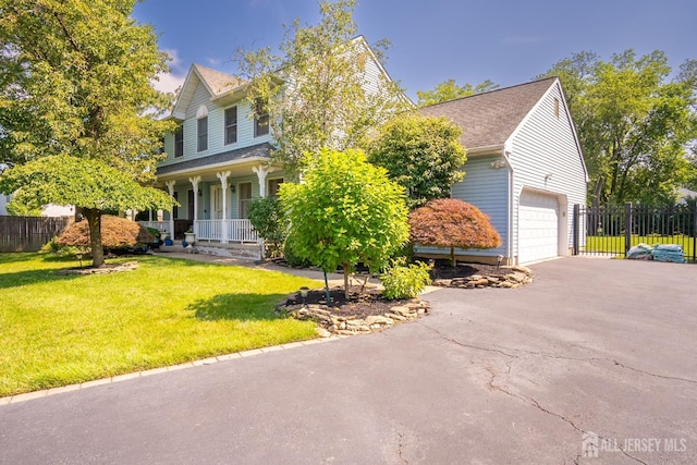 10 Chelsea Ct, South Brunswick, NJ 08810 - view of front facade featuring a porch, asphalt driveway, a garage, and roof with shingles