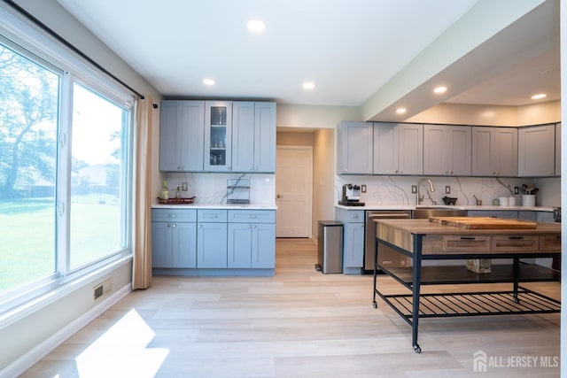 10 Chelsea Ct, South Brunswick, NJ 08810 - kitchen featuring gray cabinetry, backsplash, light countertops, recessed lighting, and glass insert cabinets